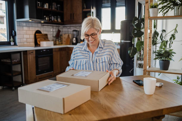 istock Young woman unboxing a delivery package 1468557992