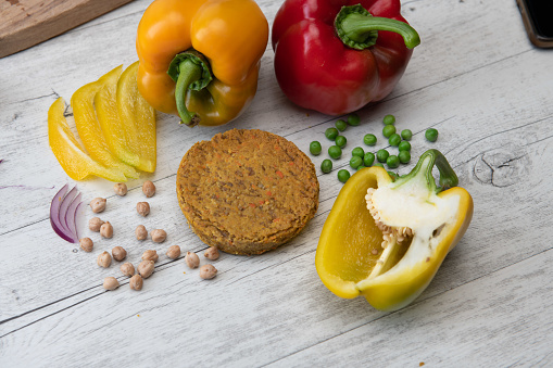 Vegan burger ingredients isolated on a  table (bell pepper and peas)