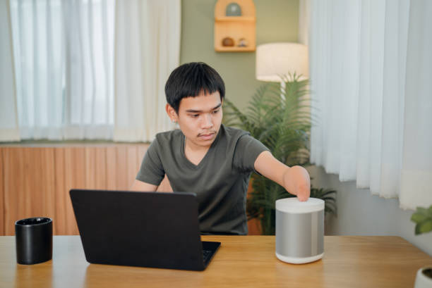 istock Handicapped man calculating personal expenses at home. 1468558808
