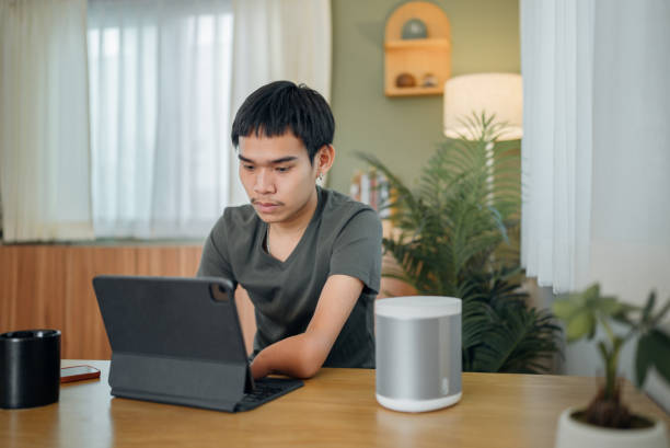 istock Handicapped man calculating personal expenses at home. 1468558958