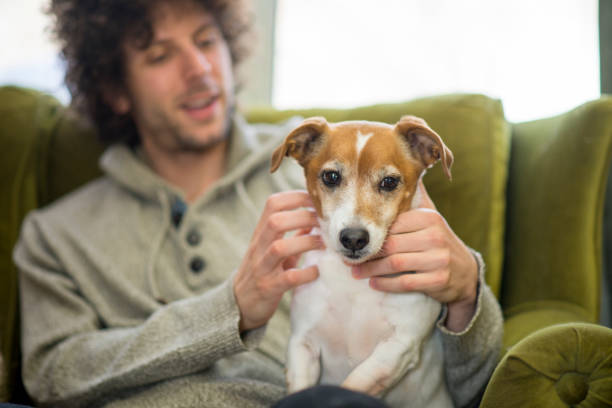 istock Man Petting His Purebred Dog 1468560684