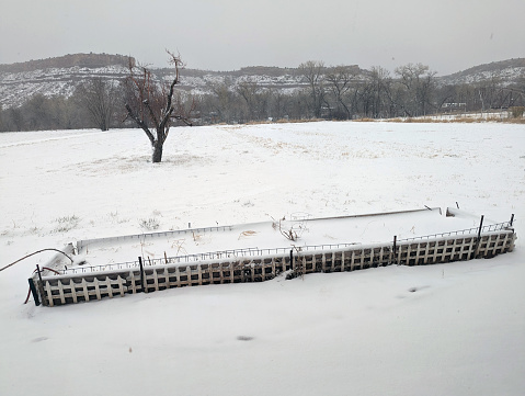 Snowy day in Rockville Utah back pasture with garden box in the foreground