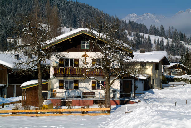 Austria, Tyrol,  house of traditional wooden construction in a wintry setting