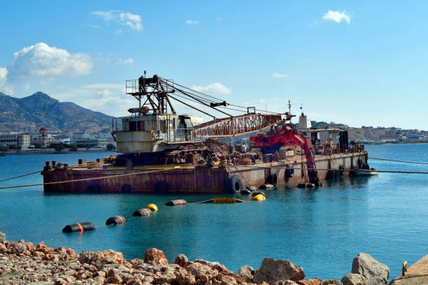 Ierapatra, Crete, Greece - October 12, 2022: Dredger during excavation work at the port of the southernmost city in Europe located on the Libyan Sea