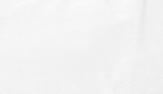 background of white jeans denim fabric texture with black space for design, close up view. abstract white denim background of rough cloth.