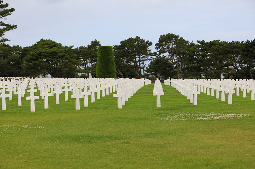 Colleville-sur-Mer, FRA, France - August 21, 2022: American Military Cemetery and many crosses on the graves of the soldiers