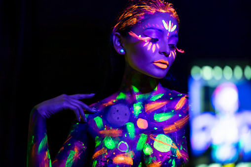 Woman Modelling Neon Body Paint With Futuristic Tinges Stock Photo -  Download Image Now - iStock
