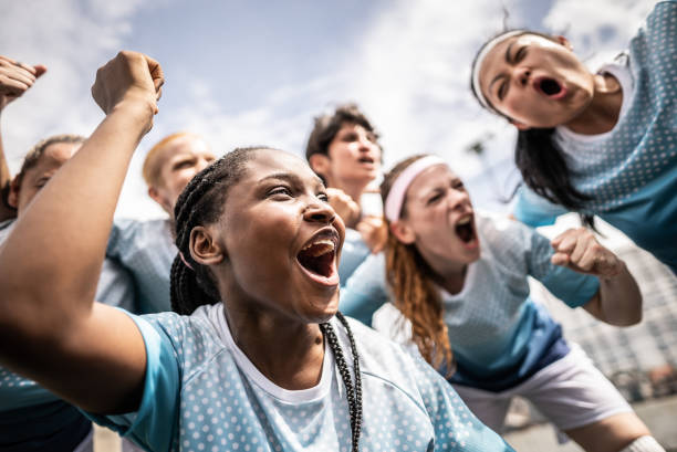 istock Happy female soccer team celebrating 1468573682