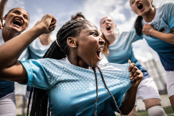 istock Happy female soccer team celebrating 1468573687