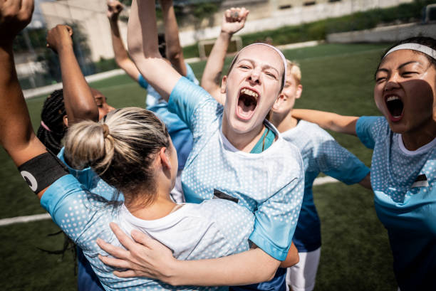istock Happy female soccer team celebrating 1468573716