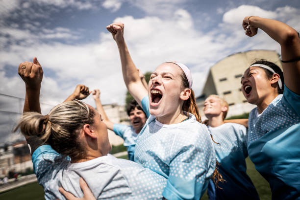 istock Happy female soccer team celebrating 1468573718
