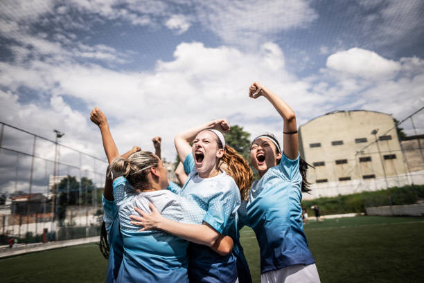 istock Happy female soccer team celebrating 1468573738