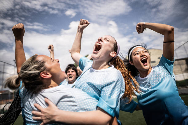 istock Happy female soccer team celebrating 1468573742