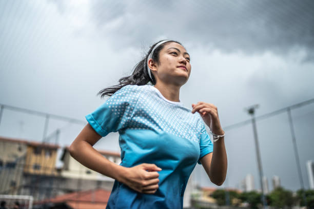 istock Female soccer player doing warm up exercise 1468573750