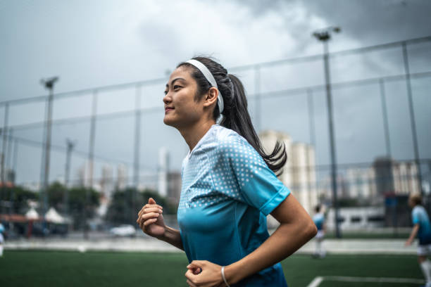 Female soccer player doing warm up exercise