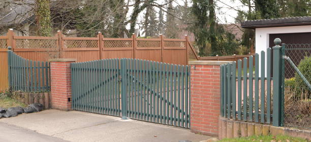 istock a driveway with a gray sliding gate 1468573790