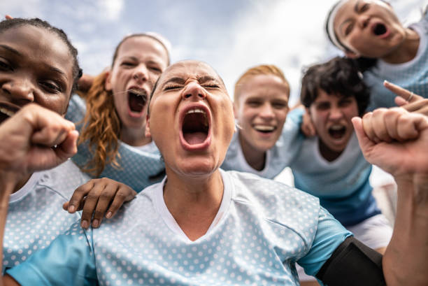 Female soccer team celebrating