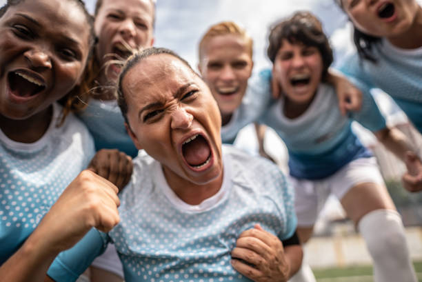 istock Female soccer team celebrating 1468574039
