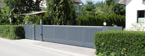 istock a driveway with a gray sliding gate 1468574045