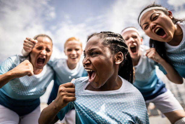 portrait of a female soccer team celebrating - team sport imagens e fotografias de stock