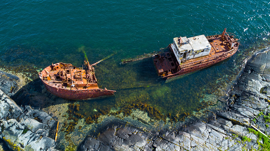Ecological catastrophe. Oil pollution of the sea. Shipwreck close to the coastline.