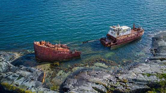 Old shipwreck about coast of Kunashir island, Kurils islands, gloomy weather