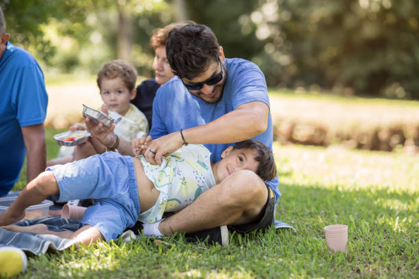 istock Father playing with his son at the picnic 1468578574