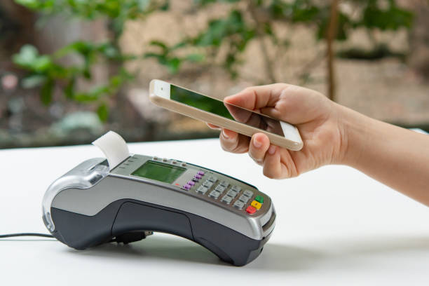 istock Contactless payment by smartphone. Payment with NFC technology 1468582539
