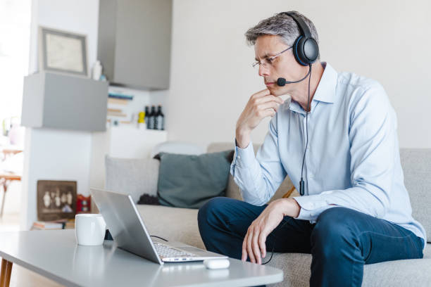 istock Mature businessman communicating on a video call with colleagues 1468585038