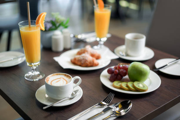 istock Hotel breakfast cappuccino, croissant, orange juice 1468585110