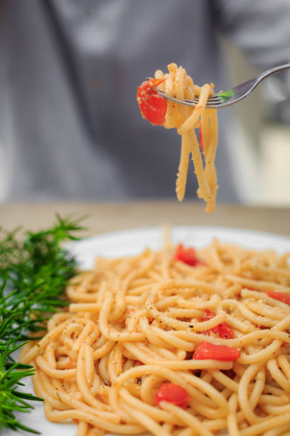 Italian spaghetti tomato pasta in the fork