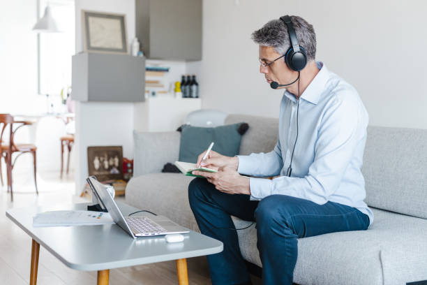 istock Mature businessman leading a team remotely 1468585325