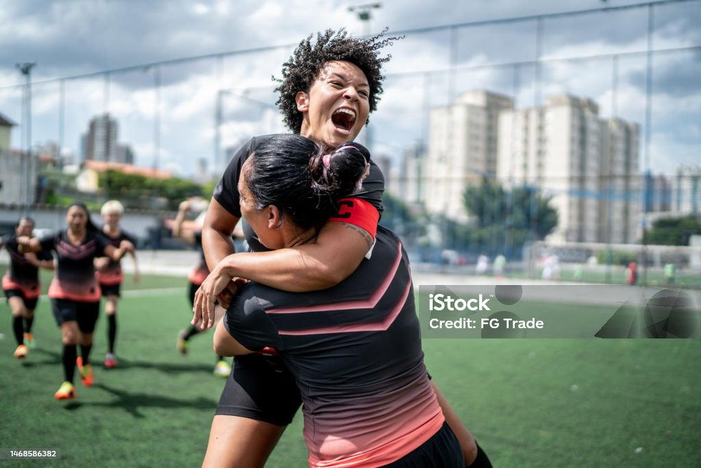 Female soccer team celebrating Soccer Stock Photo