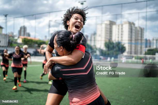 Female Soccer Team Celebrating Stock Photo - Download Image Now - Soccer, Sport, Teamwork
