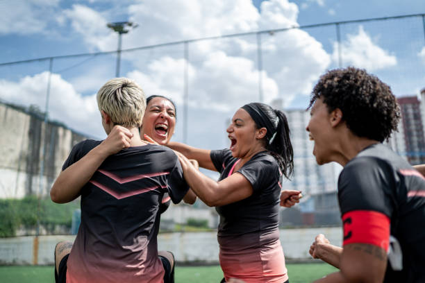 istock Female soccer team celebrating 1468586406