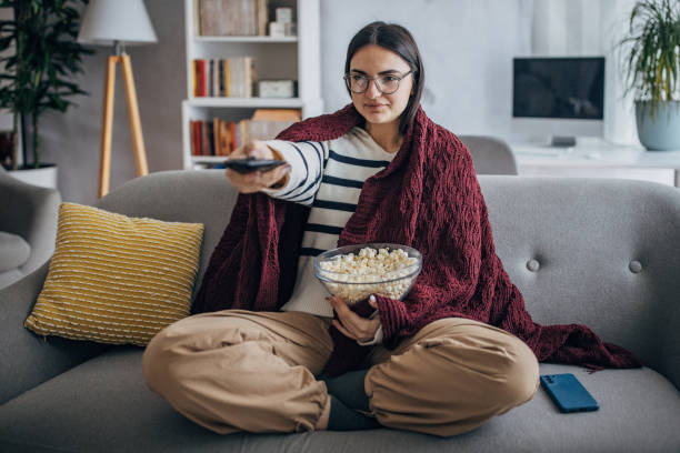 istock Woman changing channels 1468587711
