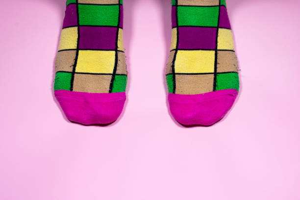 istock Colorful socks on pink background 1468591702