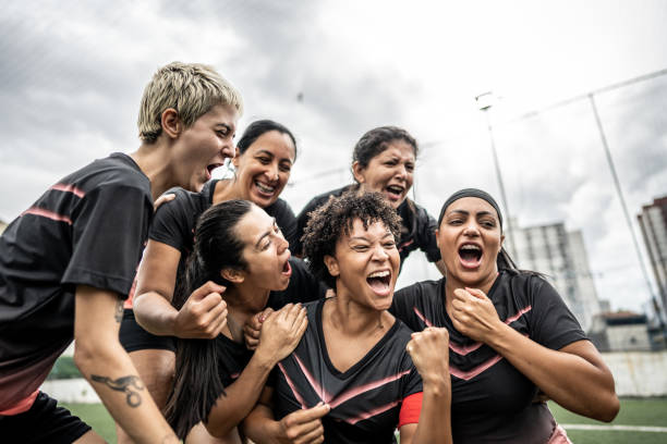 istock Happy female soccer team celebrating 1468592829