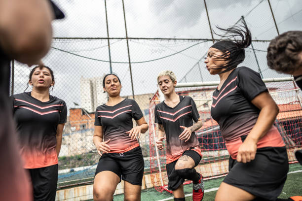 istock Female soccer team doing warm up exercise before match 1468592836