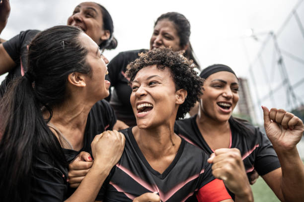 istock Happy female soccer team celebrating 1468592847