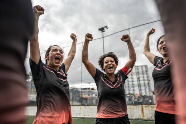 istock Female soccer team huddling in the field 1468592849