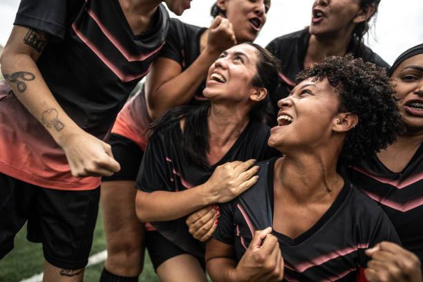 istock Happy female soccer team celebrating 1468593023