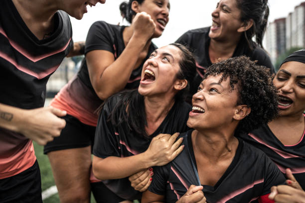 istock Happy female soccer team celebrating 1468593417