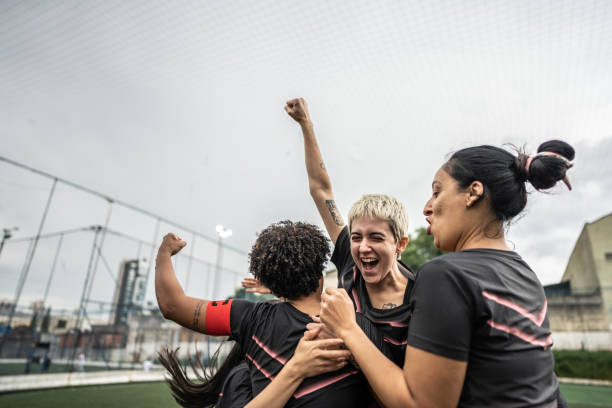 istock Happy female soccer team celebrating 1468593441