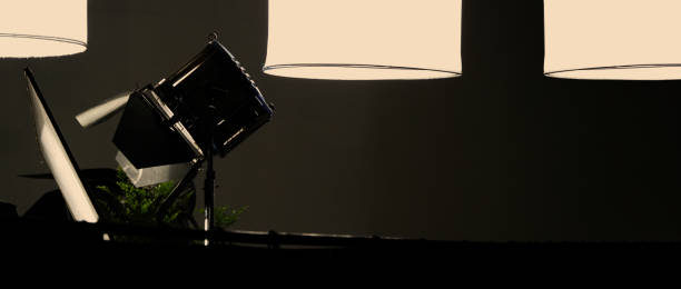 istock Film light for video production camera in studio set. Use as studio photo shoot light. Big LED spot light 5000w and diffuser or black panel create light like sun light can make daytime or golden hour 1468593470