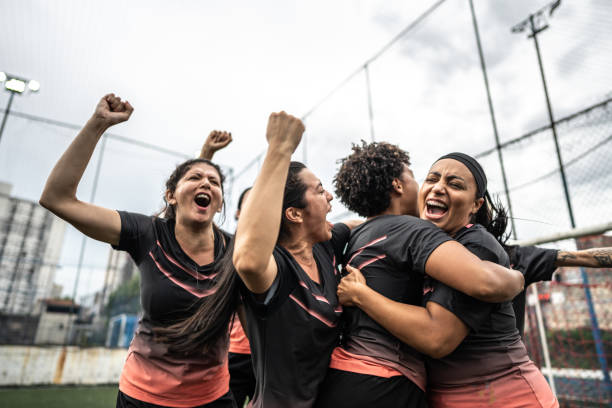 istock Happy female soccer team celebrating 1468593504
