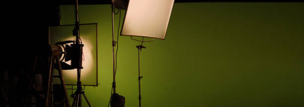 istock Film light for video production camera in studio set. Use as studio photo shoot light. Big LED spot light 5000w and diffuser or black panel create light like sun light can make daytime or golden hour 1468593511