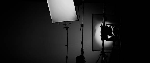 istock Film light for video production camera in studio set. Use as studio photo shoot light. Big LED spot light 5000w and diffuser or black panel create light like sun light can make daytime or golden hour 1468593517