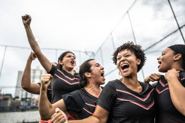 istock Happy female soccer team celebrating 1468593520