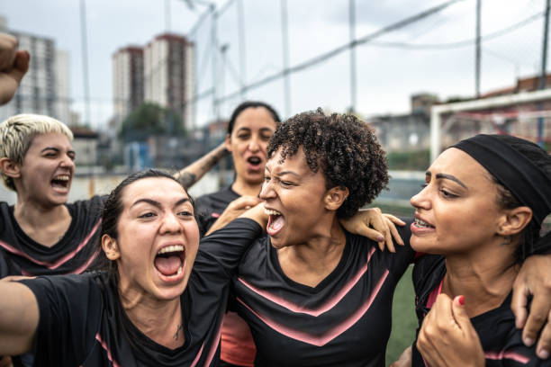 istock Happy female soccer team celebrating 1468593522